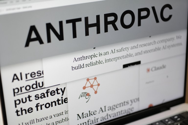 Pages from the Anthropic website and the company's logo are displayed on a computer screen