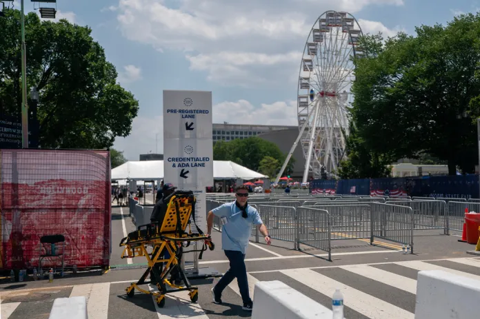 Medics carry a gurney through the grounds of the Great American State Fair after the event was closed for the afternoon due to extreme heat on the National Mall, Friday, July 3, 2026, in Washington.