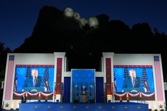 President Donald Trump speaking in front of Mount Rushmore.