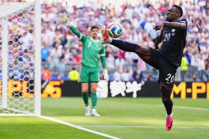 United States' Folarin Balogun tries to control the ball during the World Cup round of 16 soccer match against Belgium in Seattle, Monday, July 6, 2026. (AP Photo/Manu Fernandez)