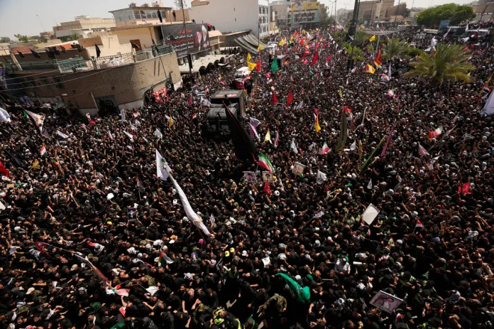 A truck carrying the coffin of the late Iranian Supreme Leader Ayatollah Ali Khamenei makes its way through mourners during a funeral procession in Najaf, Iraq, Wednesday, July 8, 2026. 