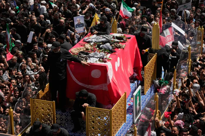 Iranians wave banners reading ‘WE WILL KILL TRUMP’ at Ali Khamenei’s funeral