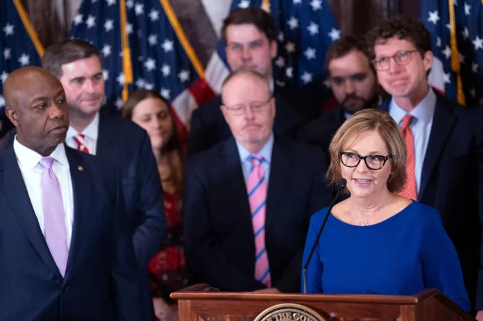 Newly-appointed U.S. interim Senator Darline Graham Nordone, right, with Sen. Tim Scott, R-S.C., left, speaks during a press conference announcing her appointment to fill the vacancy created by the passing of her brother, U.S. Sen. Lindsey Graham, at the statehouse