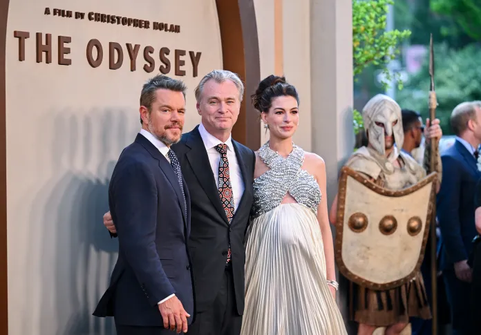 Matt Damon, left, Christopher Nolan, and Anne Hathaway.