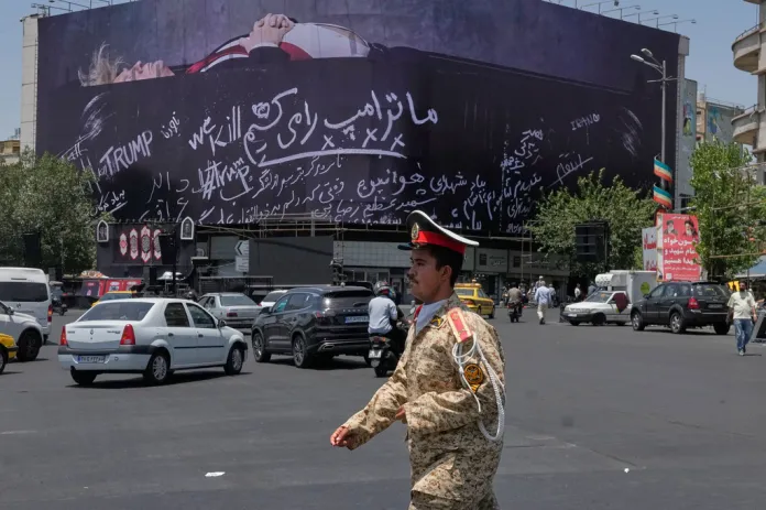 Tehran billboard shows a dead Trump and references to destroyed Minab elementary school