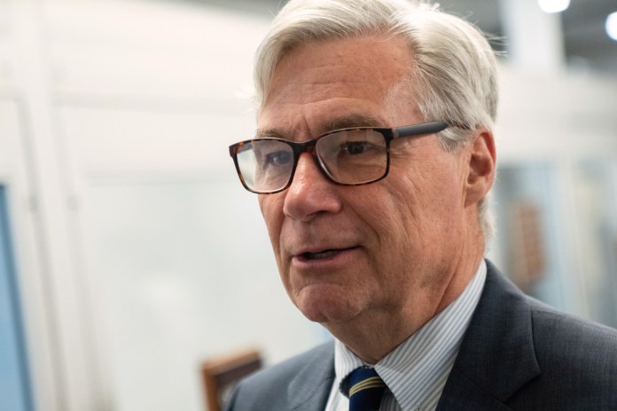 Sen. Sheldon Whitehouse, D-R.I., walks through the Capitol during votes in Washington, Thursday, July 16, 2026.