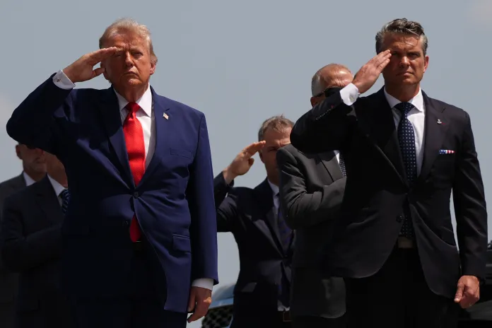 President Donald Trump and War Secretary Pete Hegseth salute