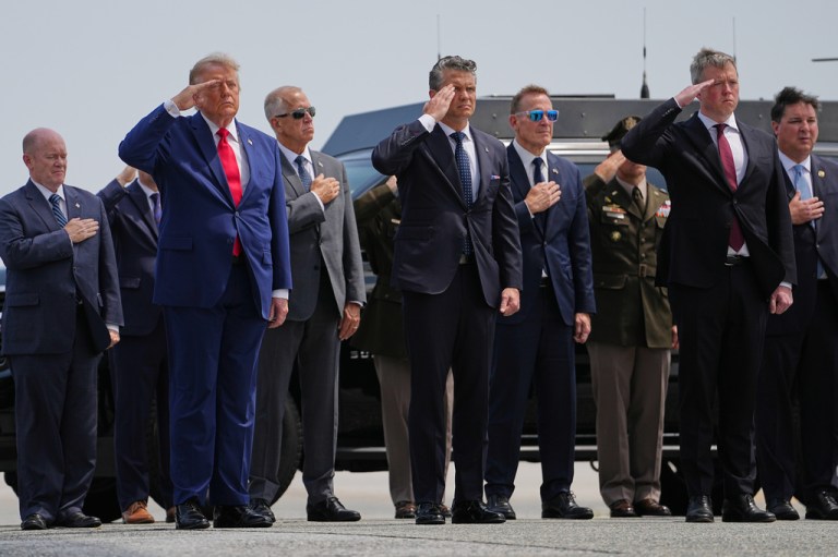 President Donald Trump, Secretary of Defense Pete Hegseth and others, salutes as a U.S. Army carry team moves a transfer case containing the remains of Pvt. Isabella Gonzales of Carrollton, Texas, Wednesday, July 22, 2026, at Dover Air Force Base, Del.