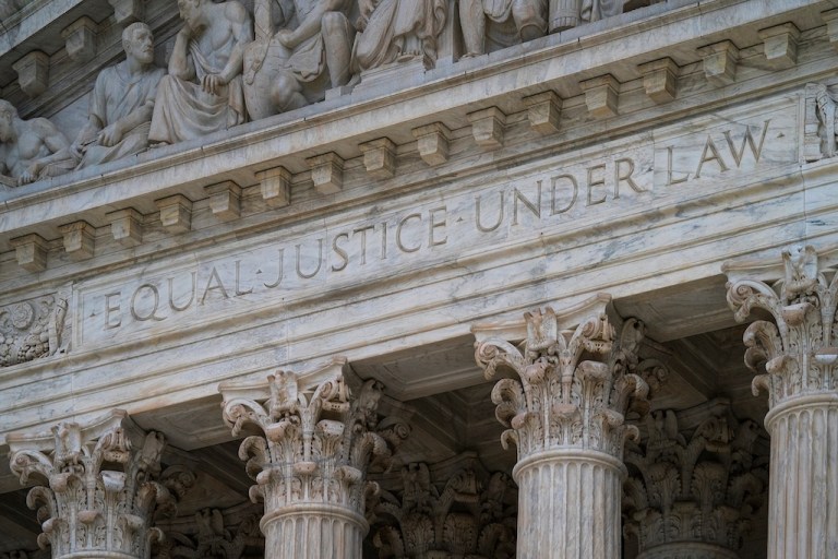 FILE - The west facade of the Supreme Court Building bears the motto "Equal Justice Under Law" on March 20, 2019, in Washington. (AP Photo/J. Scott Applewhite, File)