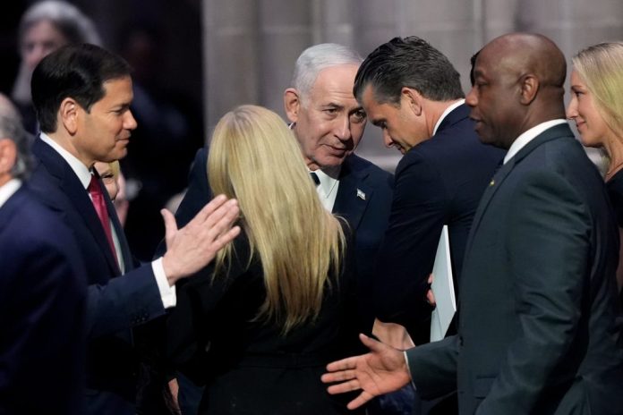 Israeli Prime Minister Benjamin Netanyahu, center, speaks to Secretary of War Pete Hegseth, right, as Secretary of State Marco Rubio, left, greets Sen. Tim Scott (R-SC) before the funeral of Sen. Lindsey Graham