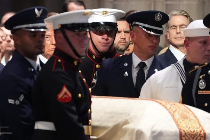 President Donald Trump watches as an Armed Forces Body Bearer Team moves the casket of Sen. Lindsey Graham during a funeral service with Vice President JD Vance and Treasury Secretary Scott Bessent