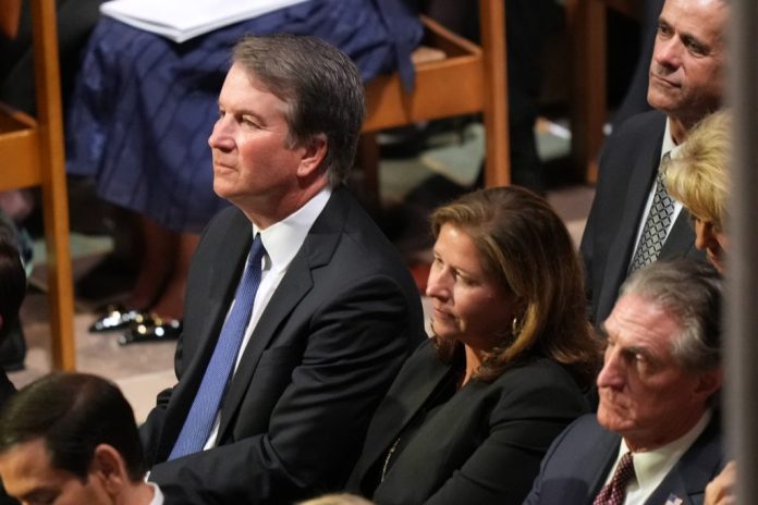 Supreme Court Justice Brett Kavanaugh and his wife, Ashley, at the funeral of Sen. Lindsey Graham