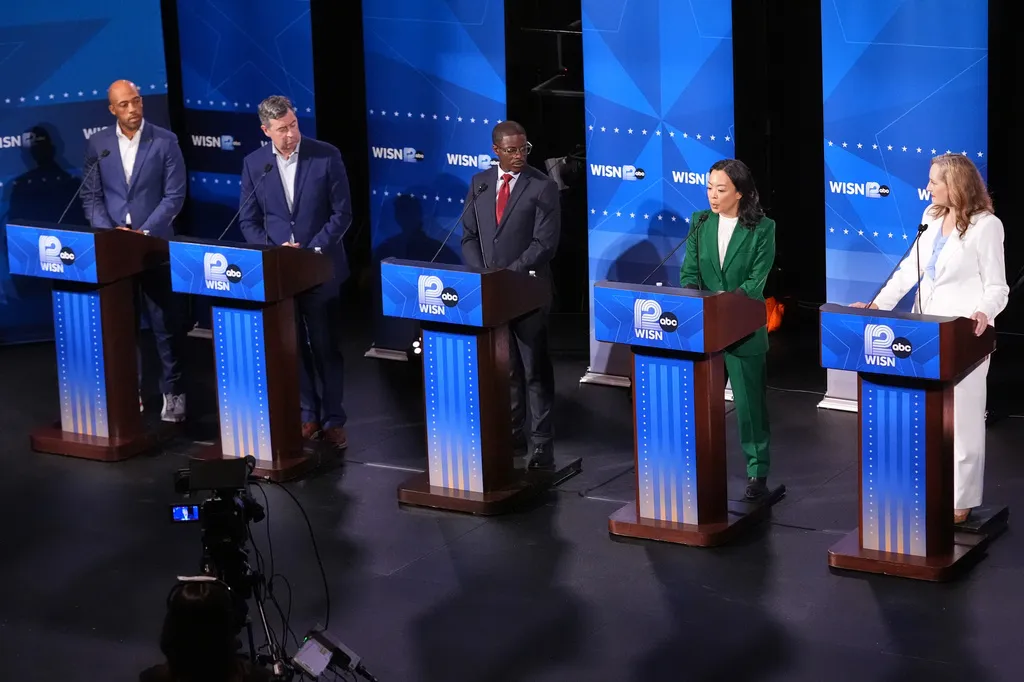 From left, Democratic gubernatorial candidates Mandela Barnes, Joel Brennan, David Crowley, Francesca Hong and Kelda Roys attend a primary debate