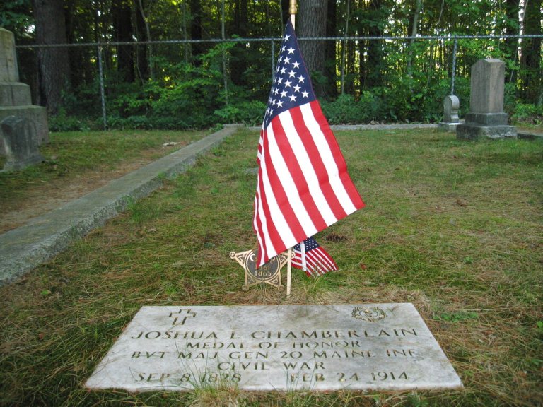 This July 12, 2012 photo shows the plaque at the gravesite in Pine Grove Cemetery in Brunswick, Maine, where Joshua Chamberlain is buried