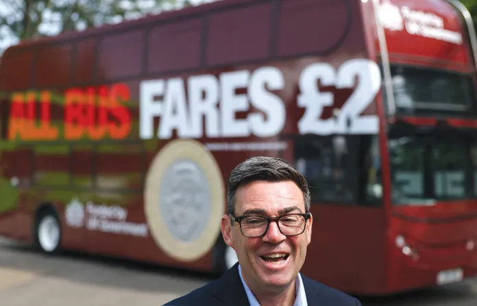 British Prime Minister Burnham in front of a FirstGroup bus in Bath, England, on July 22. (Toby Melville/Pool Photo via AP)