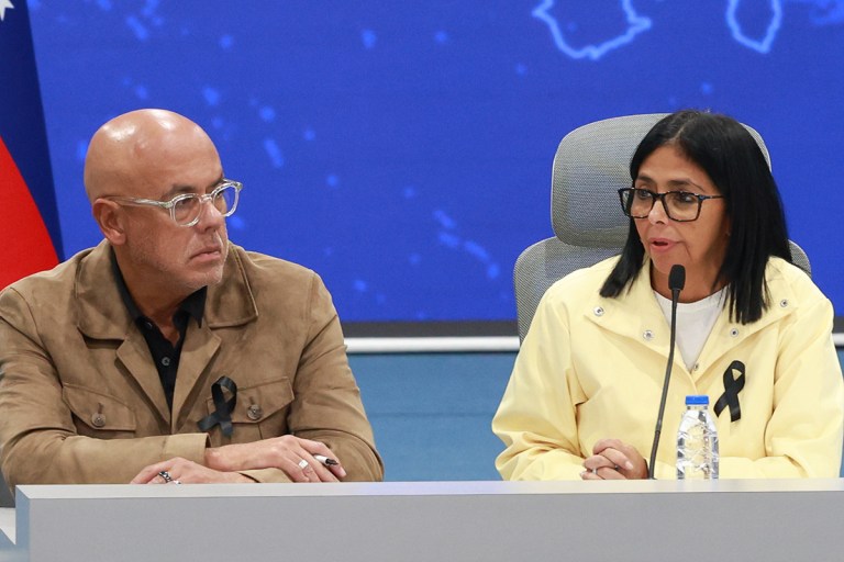 Venezuela's interim president, Delcy Rodriguez, is accompanied by the president of the National Assembly, Jorge Rodriguez.