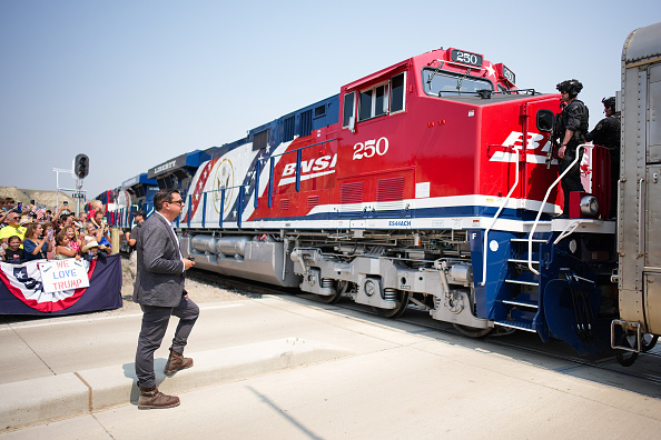 U.S. President Donald Trump rides a Freedom250-themed train en route to a dedication ceremony for the Theodore Roosevelt Presidential Library.