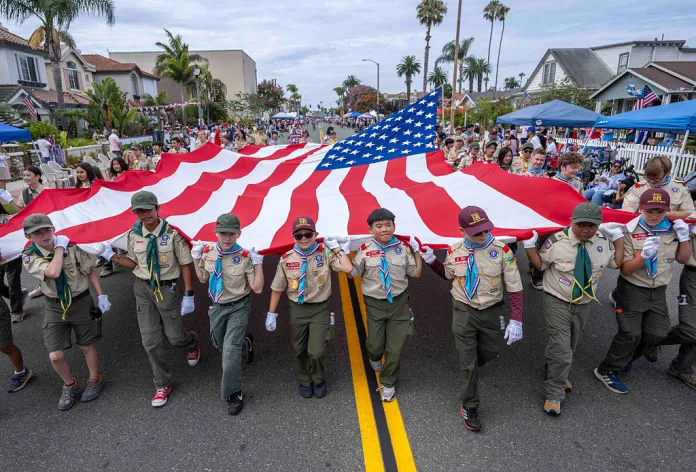 Members from Huntington Beach's Boy Scouts of America Troop 1 carry a giant American flag along Main Street as they participate in the 122nd Huntington Beach 4th of July Parade in Huntington Beach on Saturday, July 4, 2026. (Photo by Jeff Antenore, Orange County Register/SCNG)