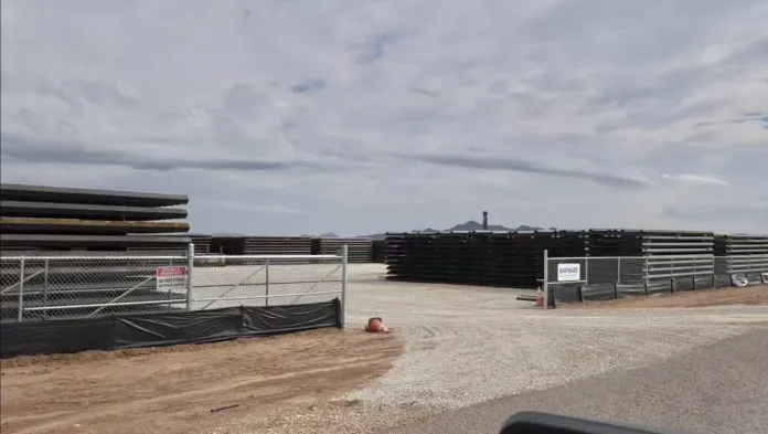 Thirty-foot-tall border wall beams on site near Big Bend National Park.