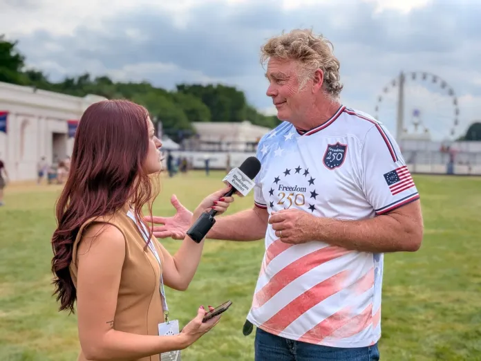Man speaking in a microphone.