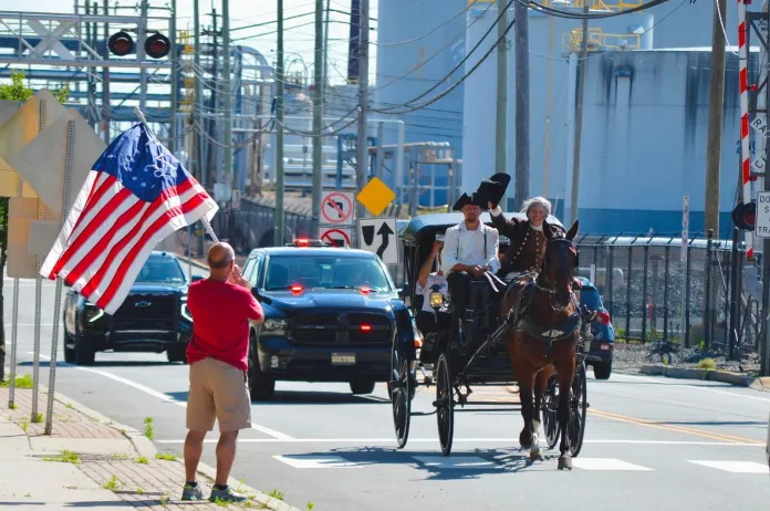 Ciro Poppiti as Caesar Rodney riding through the streets of Philadelphia