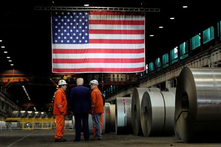 Trump in a manufacturing warehouse.