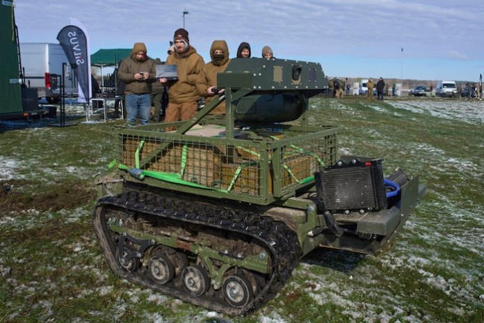 A manufacturer demonstrates a Ukrainian made unmanned ground vehicle at a Ukraine Defense Innovations exhibition for military clients on an undisclosed location in Ukraine, Friday, April 11, 2025. (AP Photo/Efrem Lukatsky)