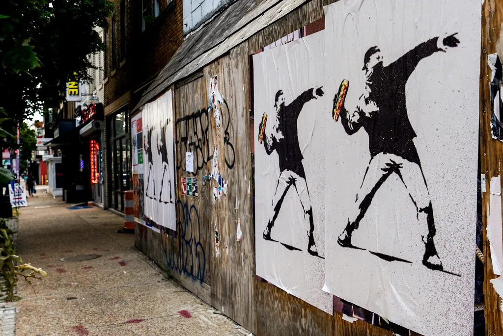 Posters depicting the sandwich-throwing man in Washington, D.C.