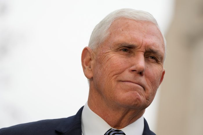 Former Vice President Mike Pence, waits outside the funeral services for former Vice President Dick Cheney.