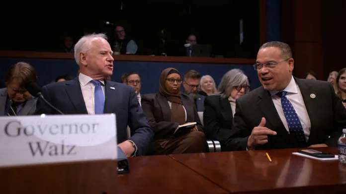 Gov. Tim Walz (D-MN),left, and Minnesota Attorney General Keith Ellison, right, talk before appearing before a House Committee on Oversight and Government Reform hearing