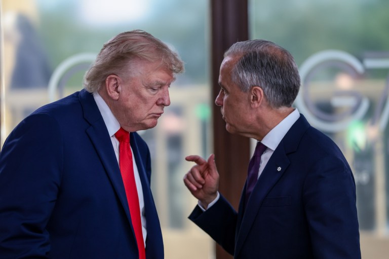 President Donald Trump speaks with Canadian Prime Minister Mark Carney.