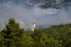 Two firefighting helicopters collide midair near Athens as Europe’s wildfire emergency rages
