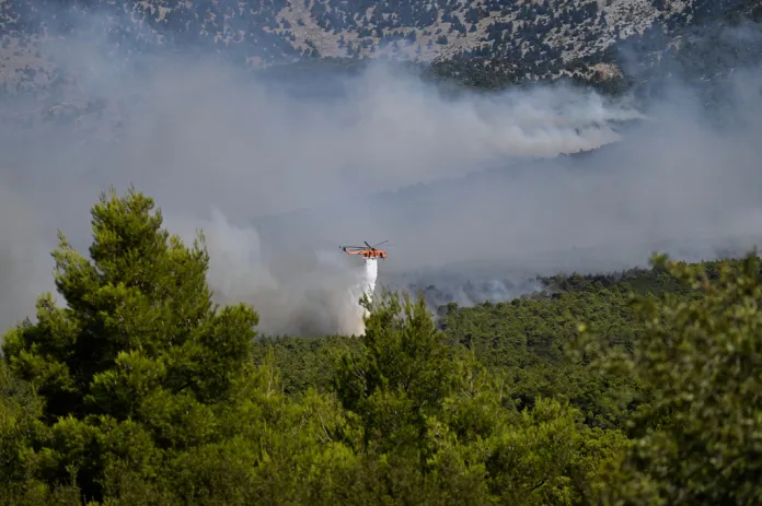 Two firefighting helicopters collide midair near Athens as Europe’s wildfire emergency rages