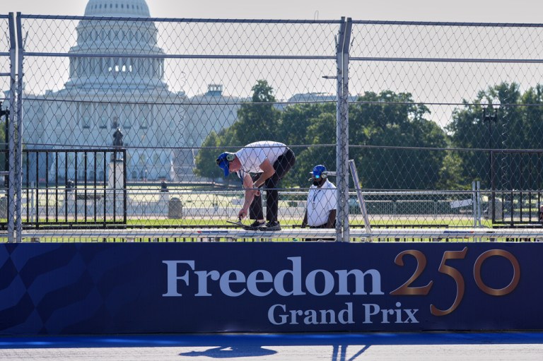 Race officials work on an area near the U.S. Capitol before the start of IndyCar Freedom 250 Grand Prix auto race in Washington, Sunday, Aug. 23, 2026. (AP Photo/Alex Brandon)