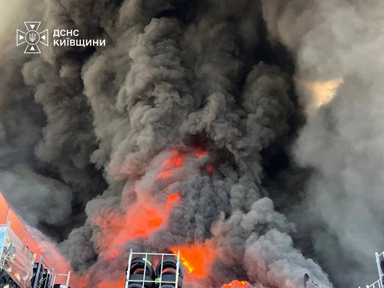 Firefighters put out a fire in a warehouse following a Russian drone attack near Kyiv, Ukraine, Saturday, Aug. 29, 2026.