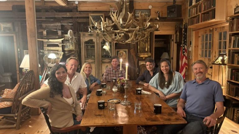 Marjorie Taylor Greene posted this picture along with the caption "the movement has begun". She is joined at the table by Brian Glenn, Tucker Carlson, Joe Kent, Thomas Massie, and others.