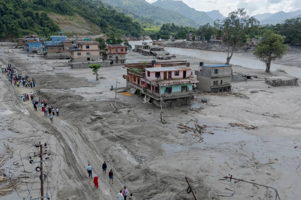 Death toll rises in Nepal-China border disaster as lake poses new flood threat