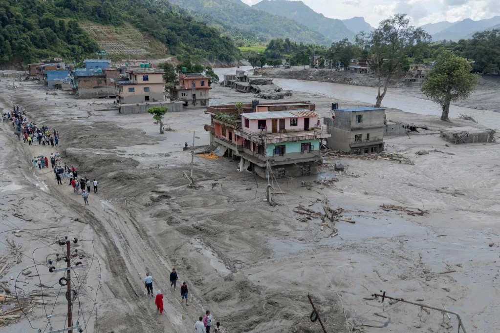 Death toll rises in Nepal-China border disaster as lake poses new flood threat