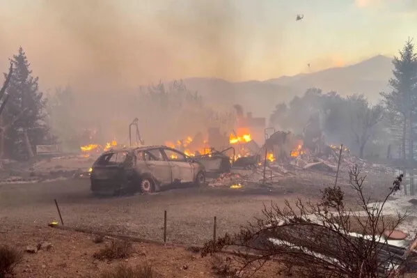Firefighters make progress against a Nevada wildfire that’s destroyed more than 30 homes