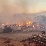Firefighters make progress against a Nevada wildfire that’s destroyed more than 30 homes