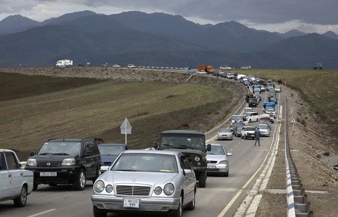 A convoy of cars of ethnic Armenians from Nagorno-Karabakh move to Kornidzor in Syunik region, Armenia in 2023, after Azerbaijan’s campaign to capture and control the Nagorno-Karabakh enclave. But since 2023, diplomatic efforts have progressed toward a formal border demarcation and a comprehensive peace agreement. (AP Photo)