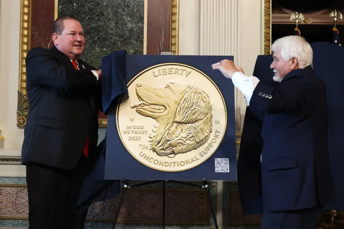 (L-R)John Miller, President & CEO, America's VetDogs, and James C. McCloughan, Specialist Fifth Class, Congressional Medal of Honor Recipient, attend as U.S. Mint and America's VetDogs unveil final designs for 2027 Working Dog Commemorative Coins at the White House on Sept. 21, 2026 in Washington, D.C.