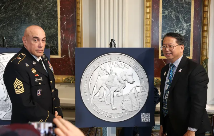 (L-R) Kevin Bittenbender and Ming Chiang attend as U.S. Mint and America's VetDogs unveil final designs for 2027 Working Dog Commemorative Coins at White House on Sept. 21, 2026, in
Washington, D.C.