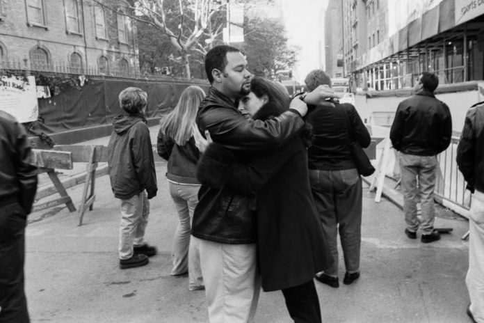 A couple embraces near Ground Zero at the site of the 9/11 terrorist attacks.