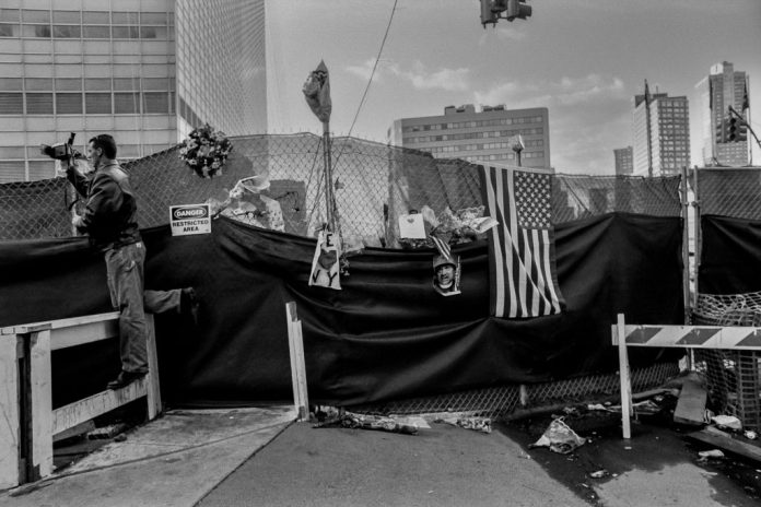A man with a video recorder near Ground Zero at the site of the 9/11 terrorist attacks.