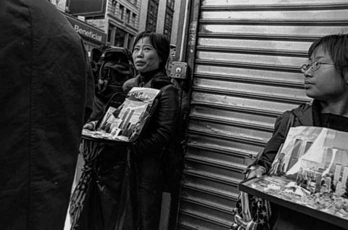 Street vendors sell World Trade Center memorabilia near Ground Zero at the site of the 9/11 terrorist attacks.