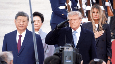 Trump winces during flyover at Xi arrival ceremony