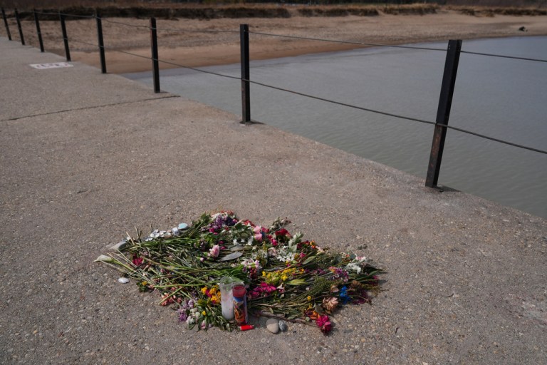 Flowers remain on a pier