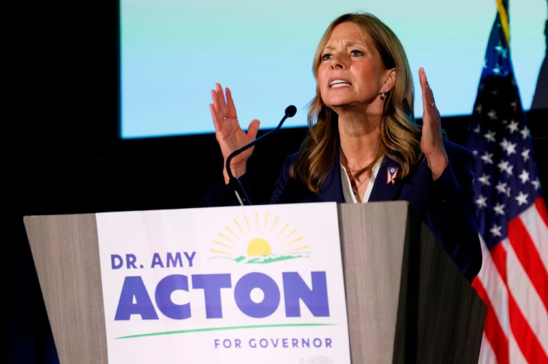 Amy Acton speaks at a podium.