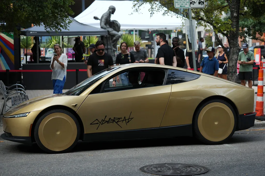 A Tesla Cybercab is parked in downtown Austin, Texas, Thursday, Sept. 3, 2026. (AP Photo/Eric Gay)